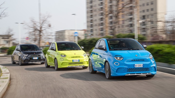 Trio of Abarth 500e Cars Driving in Urban Area
