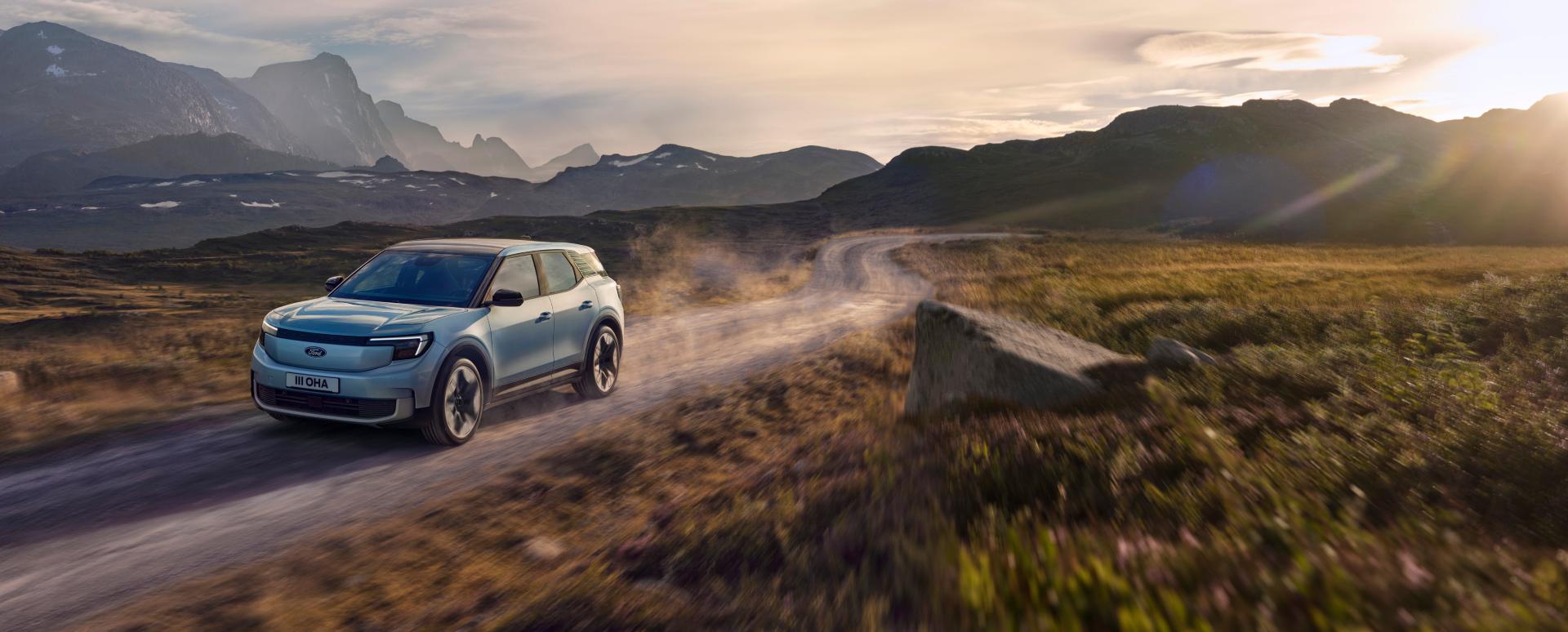 Blue Ford Explorer Exterior Front Driving Mountains