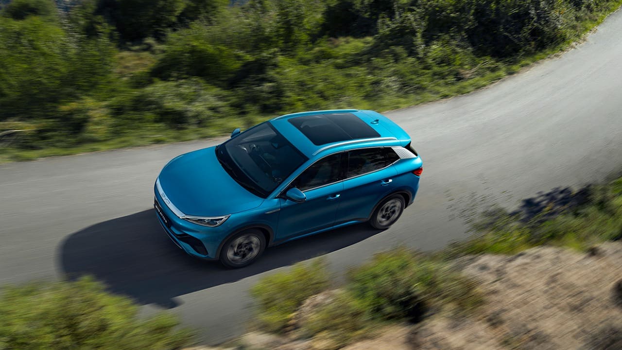 Blue BYD ATTO 3 Driving On Road View From Above