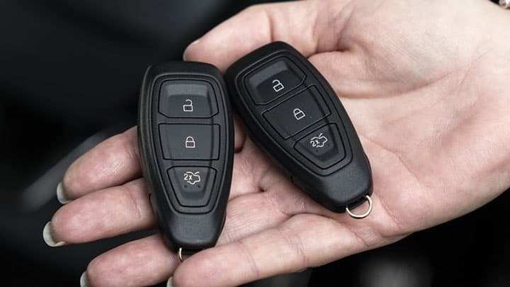 Car key fob, resting on someone's hand