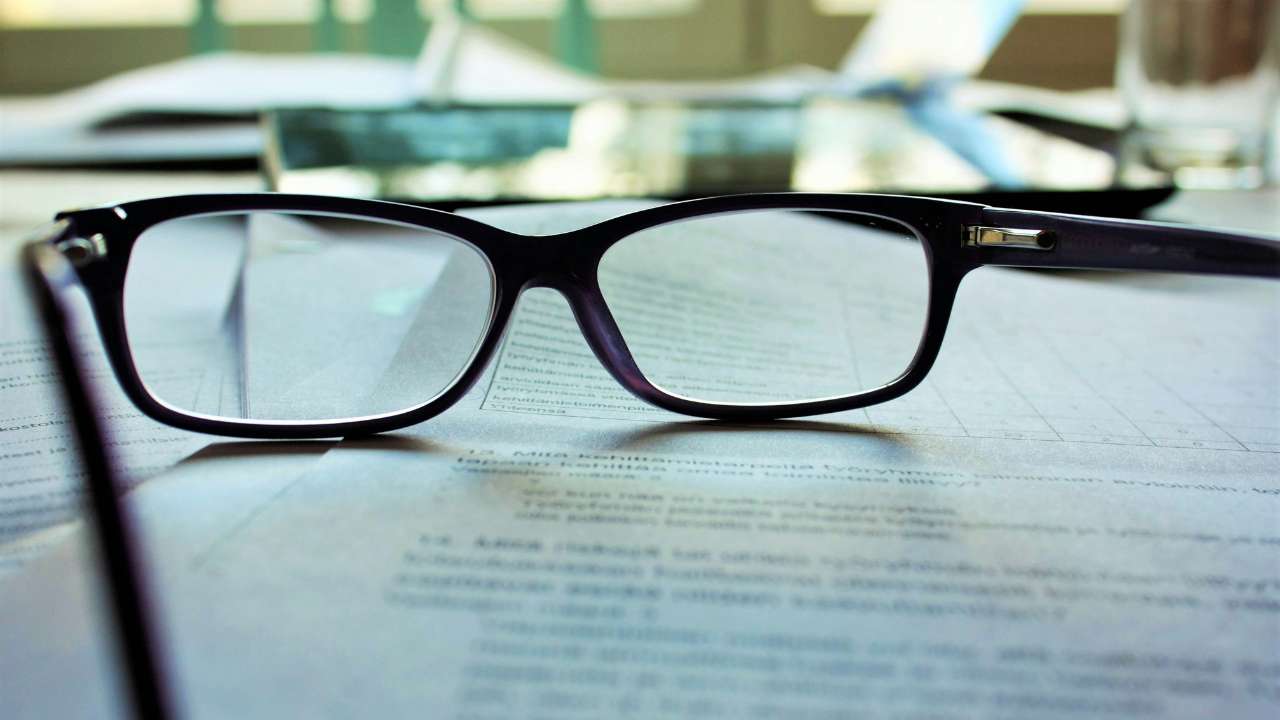 Glass over a contract on the table