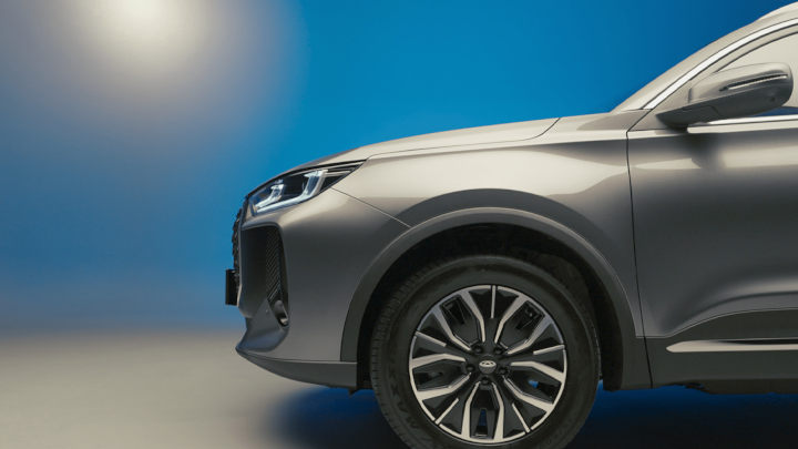 Grey Chery Tiggo 7 Front Half Side View Blue and Grey Backdrop