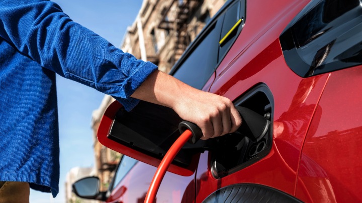 Electric Car Charger Being Inserted Into Citroen e-C3 Van