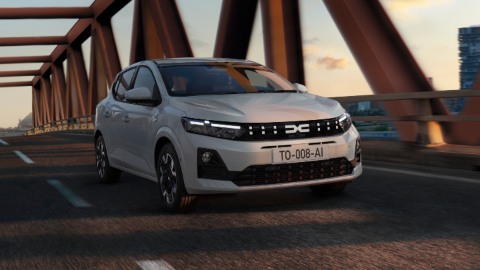 White Dacia Sandero Exterior Front Driving on Bridge