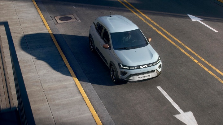 Dacia Spring Aerial front  on road
