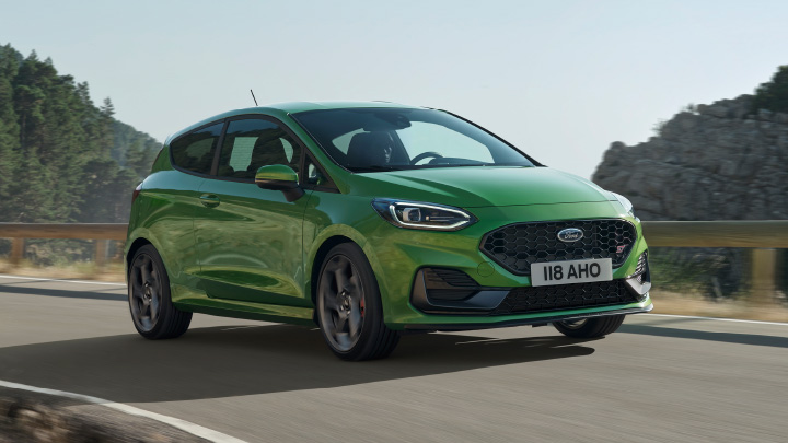 Green Ford Fiesta ST, driving down country road