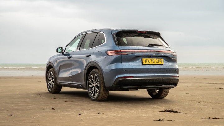 Geely Starray EM-i blue rear angle beach