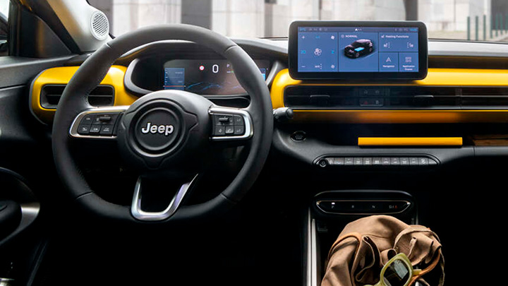 Close up of a Jeep Avenger's steering wheel and infotainment screen