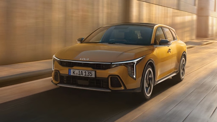 Yellow Kia K4 Exterior Front Driving
