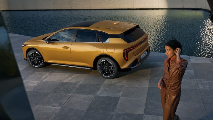 Yellow Kia K4 Exterior Side Static with Female