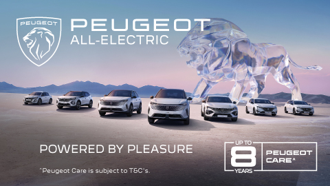 Fleet of Peugeot cars parked in front of mountains with a glass lion in the background
