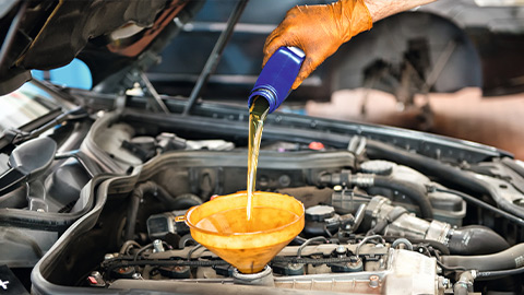Engine oil being refilled during annual service