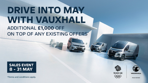 Three Vauxhall Vans Parked With Promotional Messaging